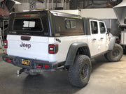 White Jeep Gladiator with black RLD truck cap