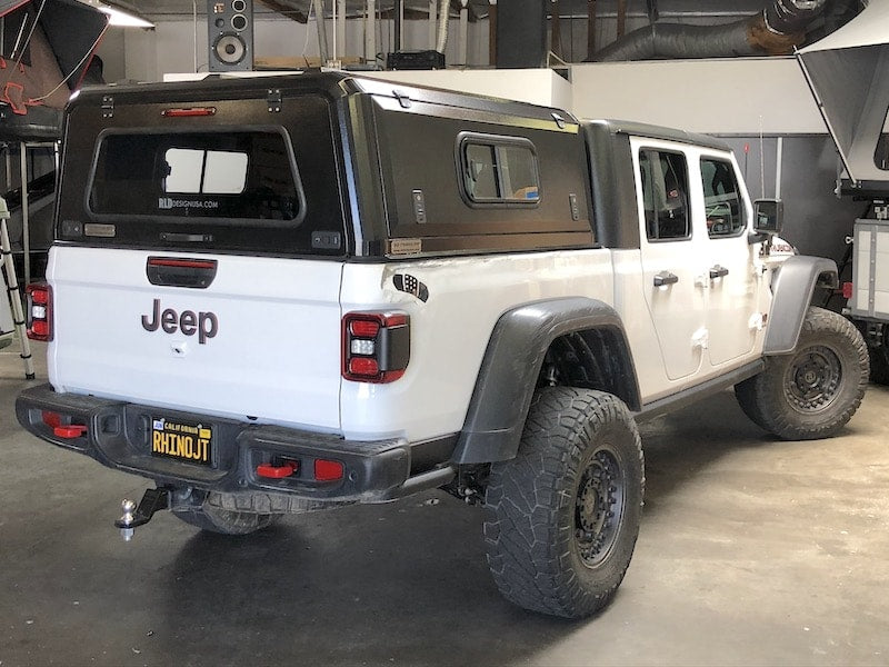 White Jeep Gladiator with black RLD truck cap
