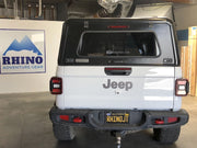 White Jeep Gladiator with black RLD truck cap Rear View
