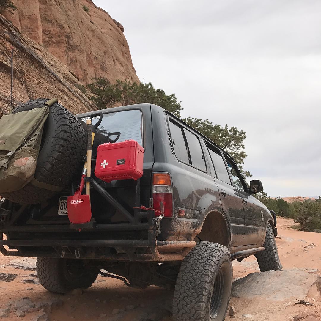 off road vehicle accessorized with quick release mounting kit and red outback first aid kit