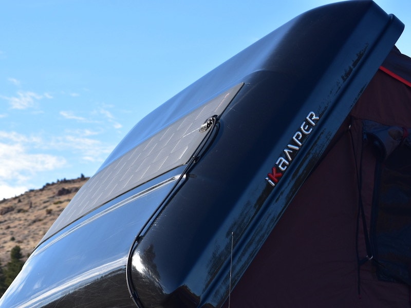 Hard-sided carbon fiber roof-top camper has solar power and heat