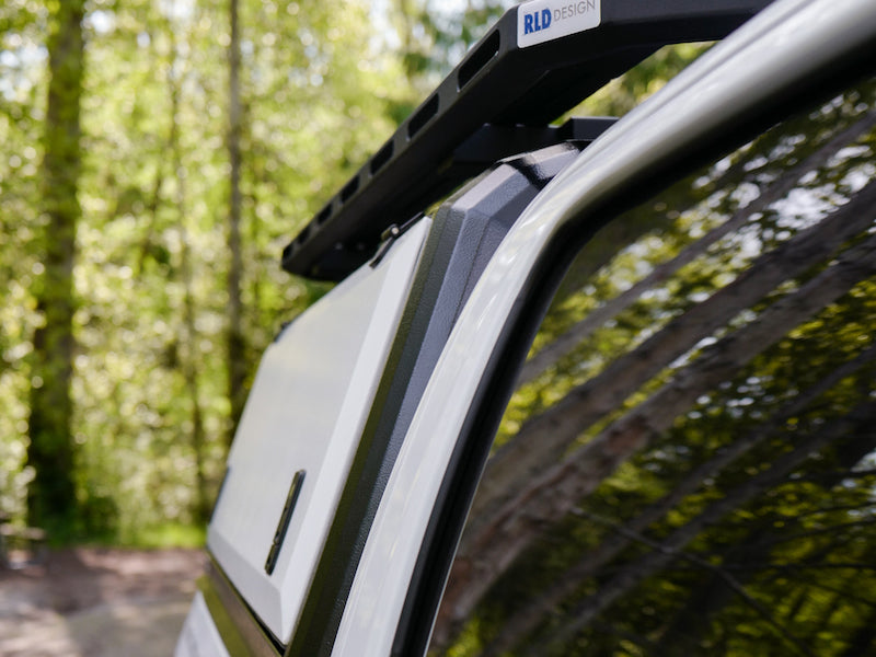 RLD Design stainless steel truck cap with side cabinet shown