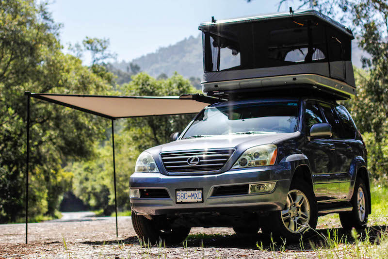 2004 Lexus GX470 shown with James Baroud Evasion Roof Top Tent erected on roof and Side Awning extended on passenger side of overland build project vehicle