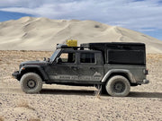 Black canopy with integrated roof top tent on Jeep Gladiator