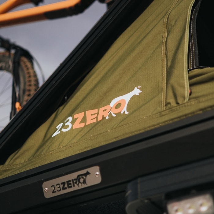 Detail of logo and hinge point of 23ZERO Kabari Hard Shell Rooftop Tent