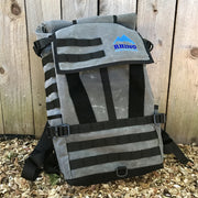 Grey waxed canvas adventure backpack with black trim and zipper and Rhino Adventure Gear embroidered logo