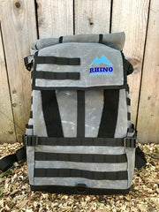 25L grey and black waxed canvas adventure backpack with blue embroidered Rhino Adventure Gear logo