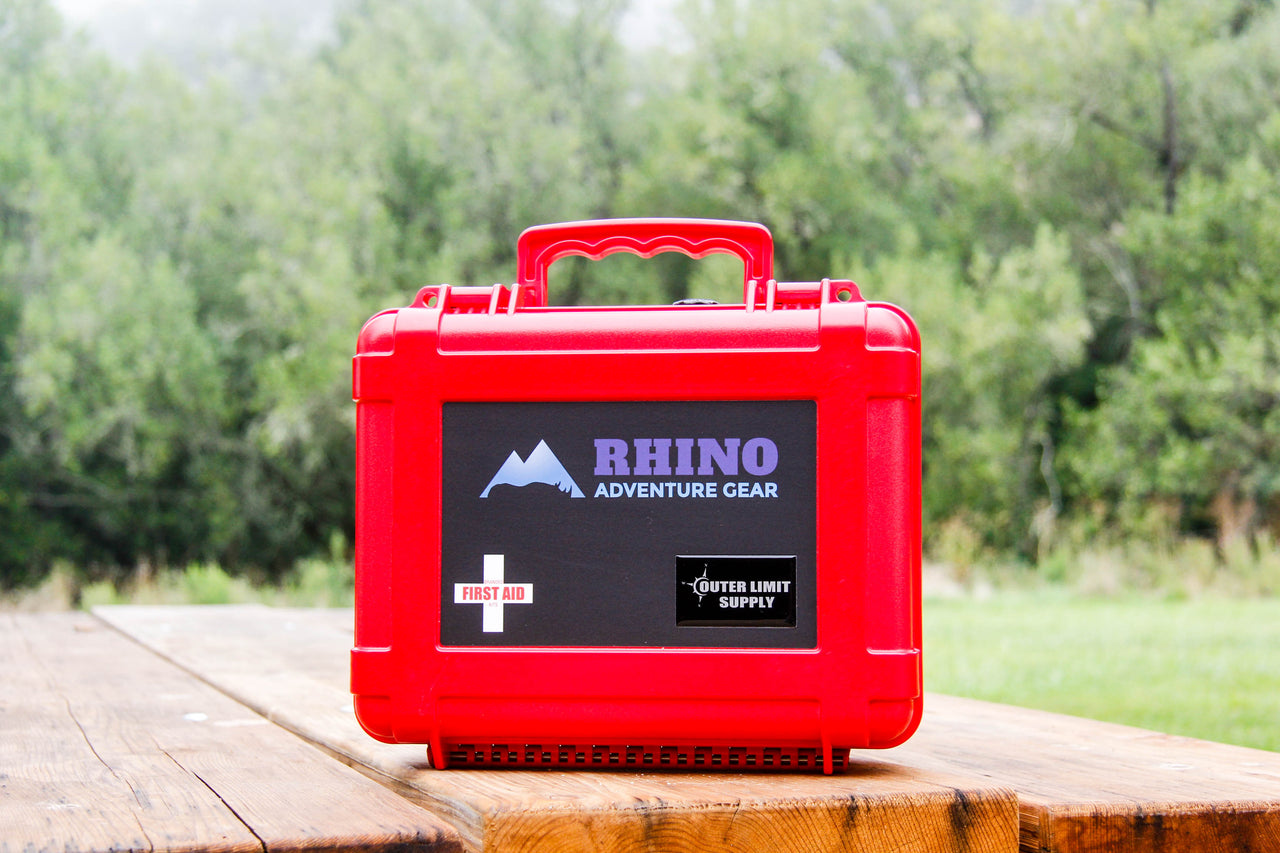 Red Emergency First Aid Kit for overland excursions with Rhino Adventure Gear logo from Outer Limit Supply