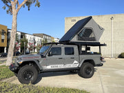 Truck cap with integrated roof top tent on Jeep Gladiator