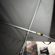 Camp King spare tent poles shown assembled supporting canvas fabric