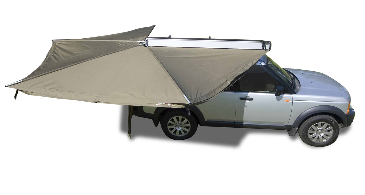 Foxwing awning shown open providing 270 degrees of shade adjacent to vehicle
