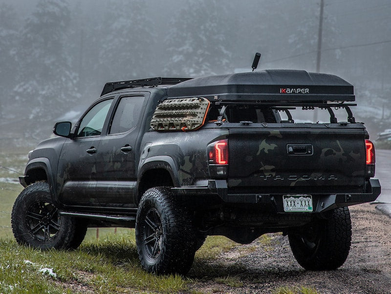 Toyota Tacoma with iKamper Mini Roof Top Tent mounted on bed rack