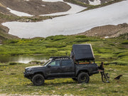 iKamper Skycamp Mini Roof Top Tent shown mounted on Tacoma bed rack - open