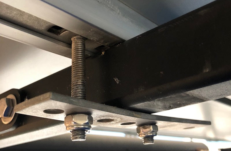 iKamper mounting brackets v 1.0 installed to mount roof top tent to crossbars of roof rack