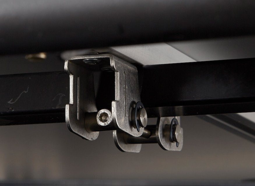 iKamper version 2.0 mounting brackets attach roof top tent to cross bar of roof rack