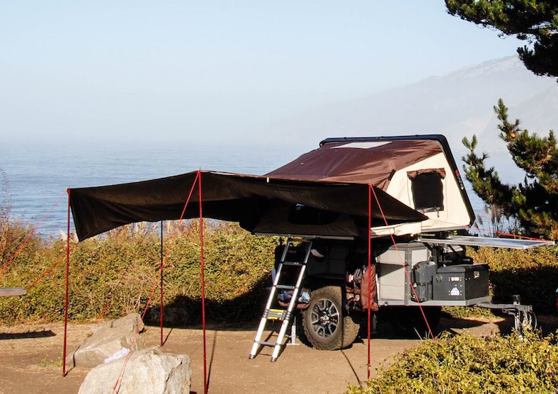 iKamper Skycamp awning for roof top tent shown overlooking ocean during backcountry camping trip