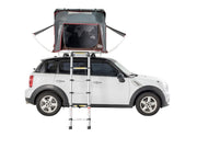 iKamper Skycamp Mini Roof Top Tent shown open on white Mini Cooper with window canopies open
