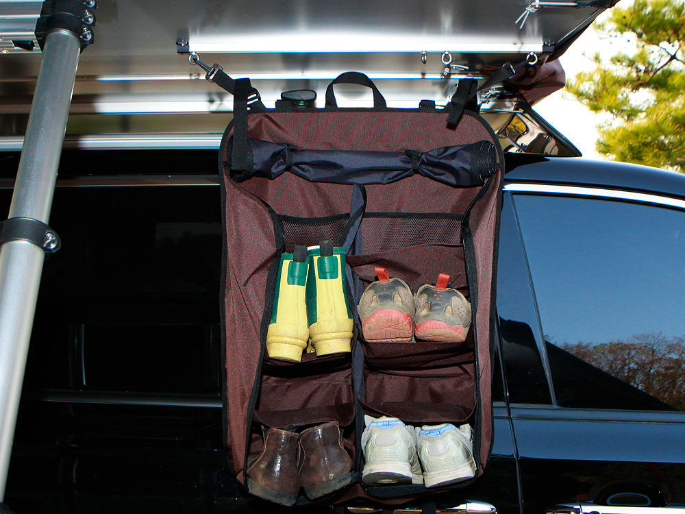 iKamper Skycamp roof top tent shoe rack hanging from bottom of roof top tent.