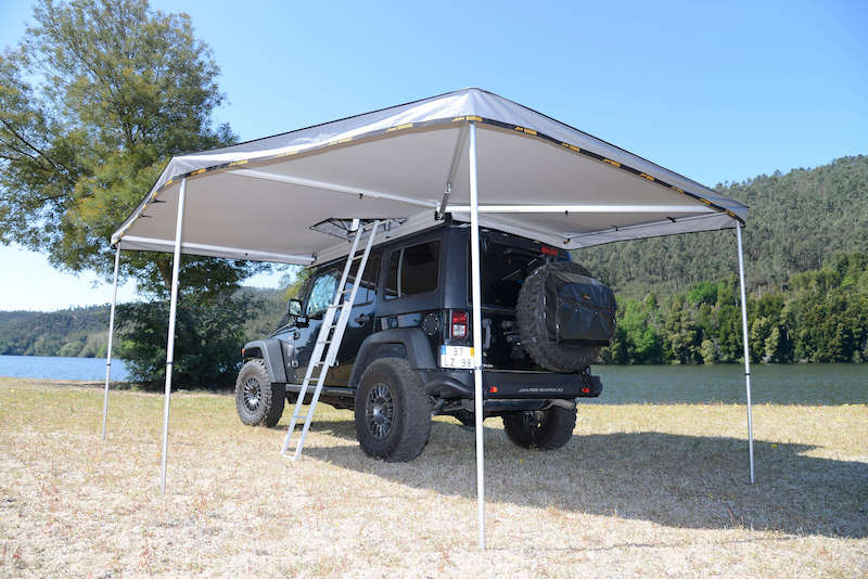 Underside view of Falcon Awning with ladder ascending to roof top tent through awning