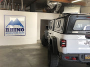 Installation of Jeep Gladiator truck cap at Rhino Adventure Gear California