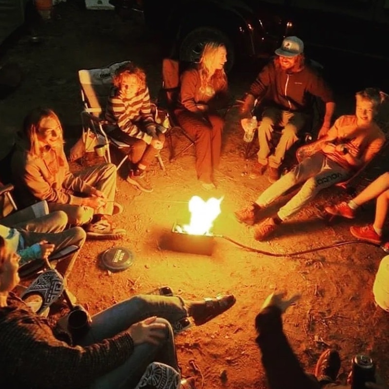 Group gathered around lavabox portable wood-free fire pit