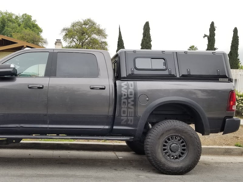 RLD Design Stainless Steel Canopy on gray RAM 2500 HD with twin doors and sliding window