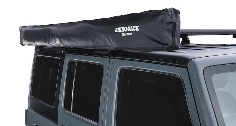 Detail of black cover bag on right side mounted rhino rack batwing awning
