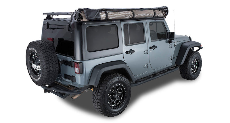 Batwing Awning mounted on passenger side of Jeep shown packed with cover bag removed