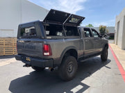 RLD Design stainless Steel Truck Cap for Ram 2500 HD Power Wagon shown with twin gull-wing doors on 8ft bed open