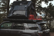 Overlanding mini solar panel on iKamper RTT in rain