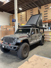 Jeep gladiator with CampKing RTT outfitted with solar panel on tent