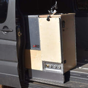Trail Kitchens Van Kitchen mounted on passenger side of camper van with back unit of kitchen visible showing quick connect fittings for external water source hook up