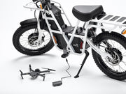 Recharging a drone using the portable battery pack equipped on Ubco 2x2 utility off road bikes
