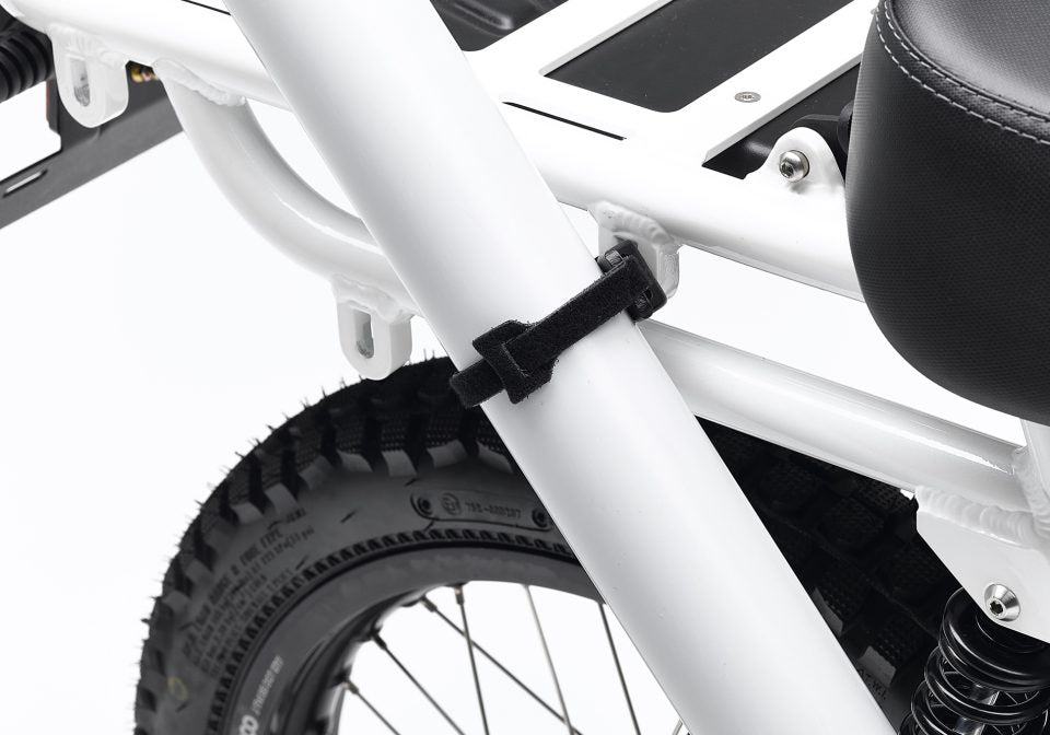 Detail of velcro strap from the 2x2 Adapter Pack attached to tubing of Ubco 2x2 frame