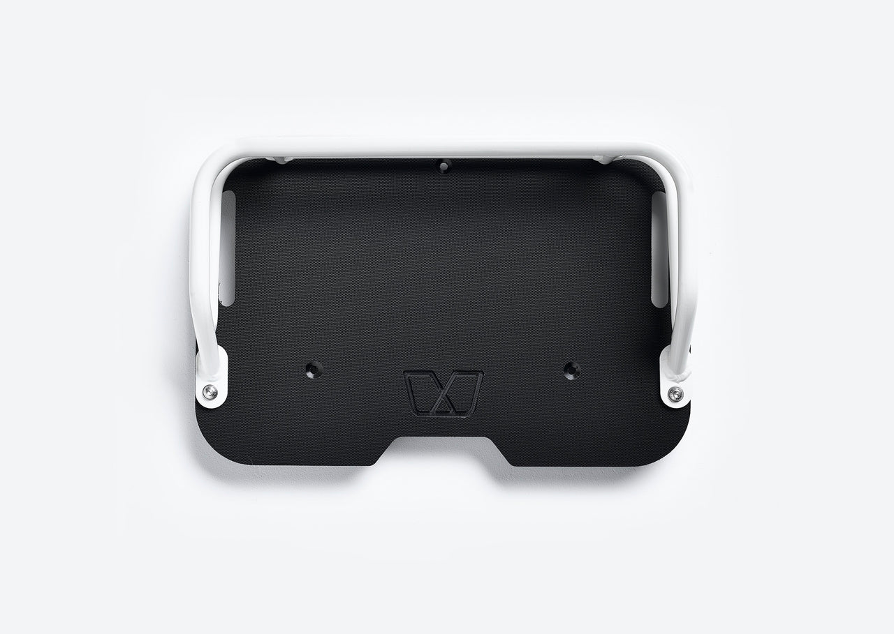 Overhead view of front cargo deck for Ubco 2x2 has dual white aluminum rails that match Ubco 2x2 bike and a solid black durable HDPE deck with subtle embossed Ubco logo
