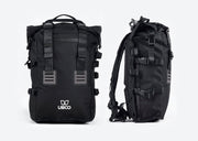 Two black Ubco Pannier Backpacks, one viewed from the front and the other viewed from the side. Backpacks have heavy-duty tactical appearance with thick straps and buckles to secure roll top flap.