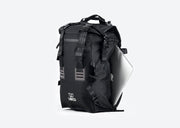 Black Pannier Backpack compatible with Ubco 2x2 Pannier Racks shown with a laptop being slid into the 15" laptop compartment