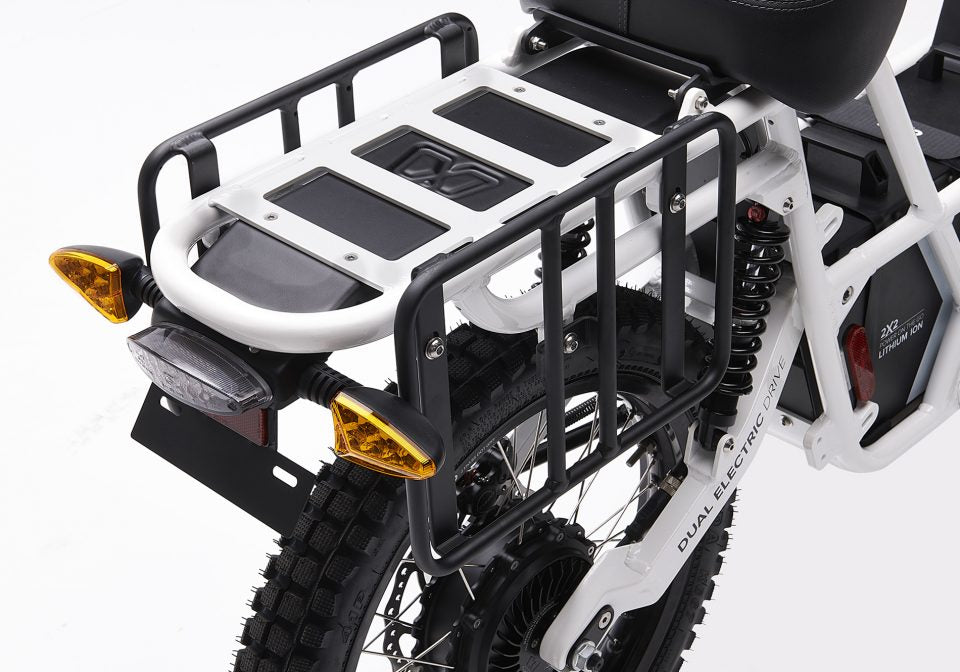 Ubco pannier racks mounted on both sides of the rear wheel of the 2x2 electric adventure bike
