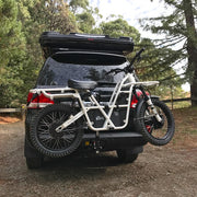 Rear view of Toyota Landcruiser with Ubco Towball Mount Bike Rack for transporting 2x2 electric motorbike