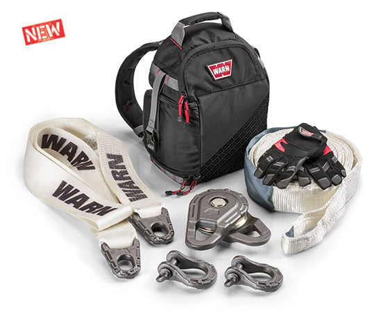 Warn Epic Recovery Kit components including tree trunk protector, epic snatch block, shackles, recovery strap, kevlar gloves and a recovery damper backpack